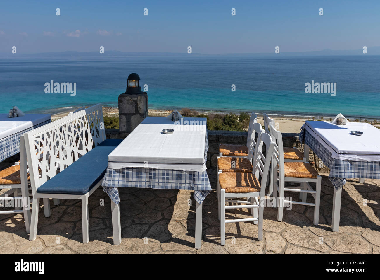 Typical Greek Restaurant at the coastline of town of Afytos, Kassandra, Chalkidiki, Central Macedonia, Greece Stock Photo