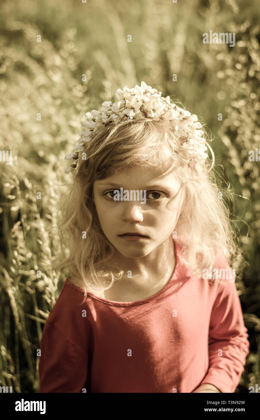 portrait of beautiful blond girl in meadow sepia toned Stock Photo - Alamy