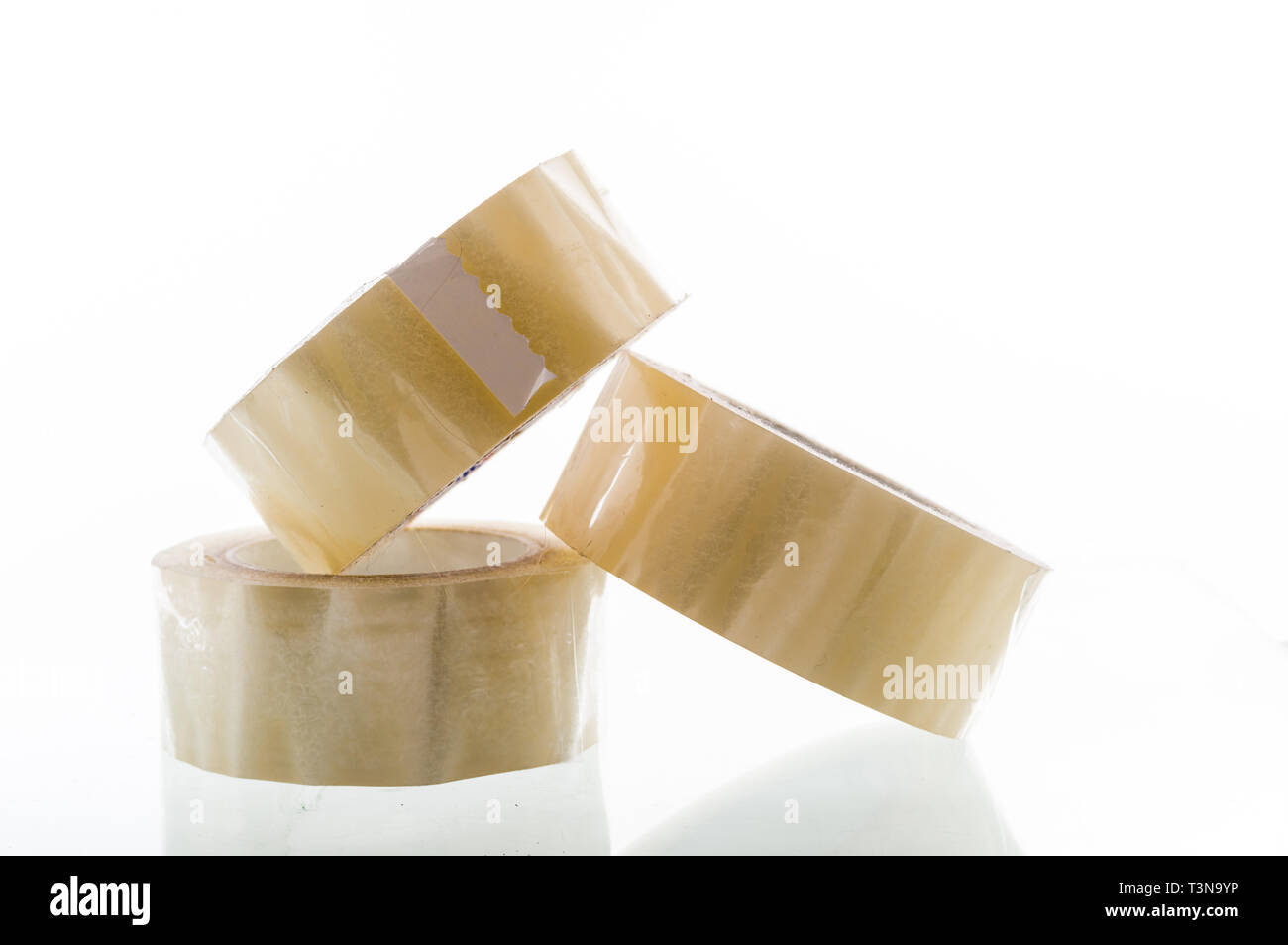 Several rolls of adhesive tape. Three rolls of packaging material. A