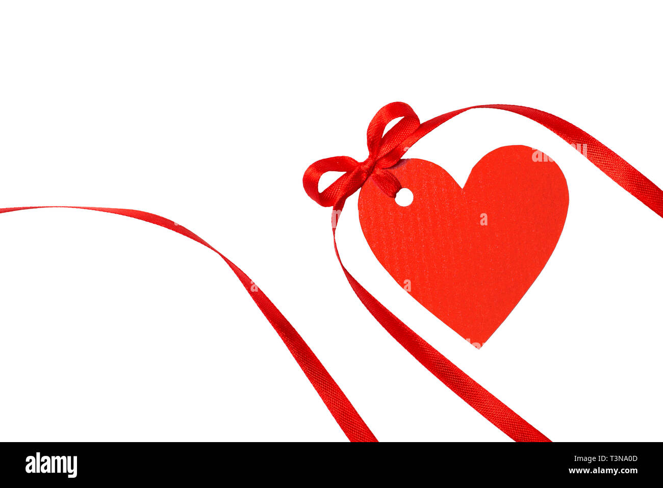 Heart tag with red ribbon isolated on white Stock Photo - Alamy