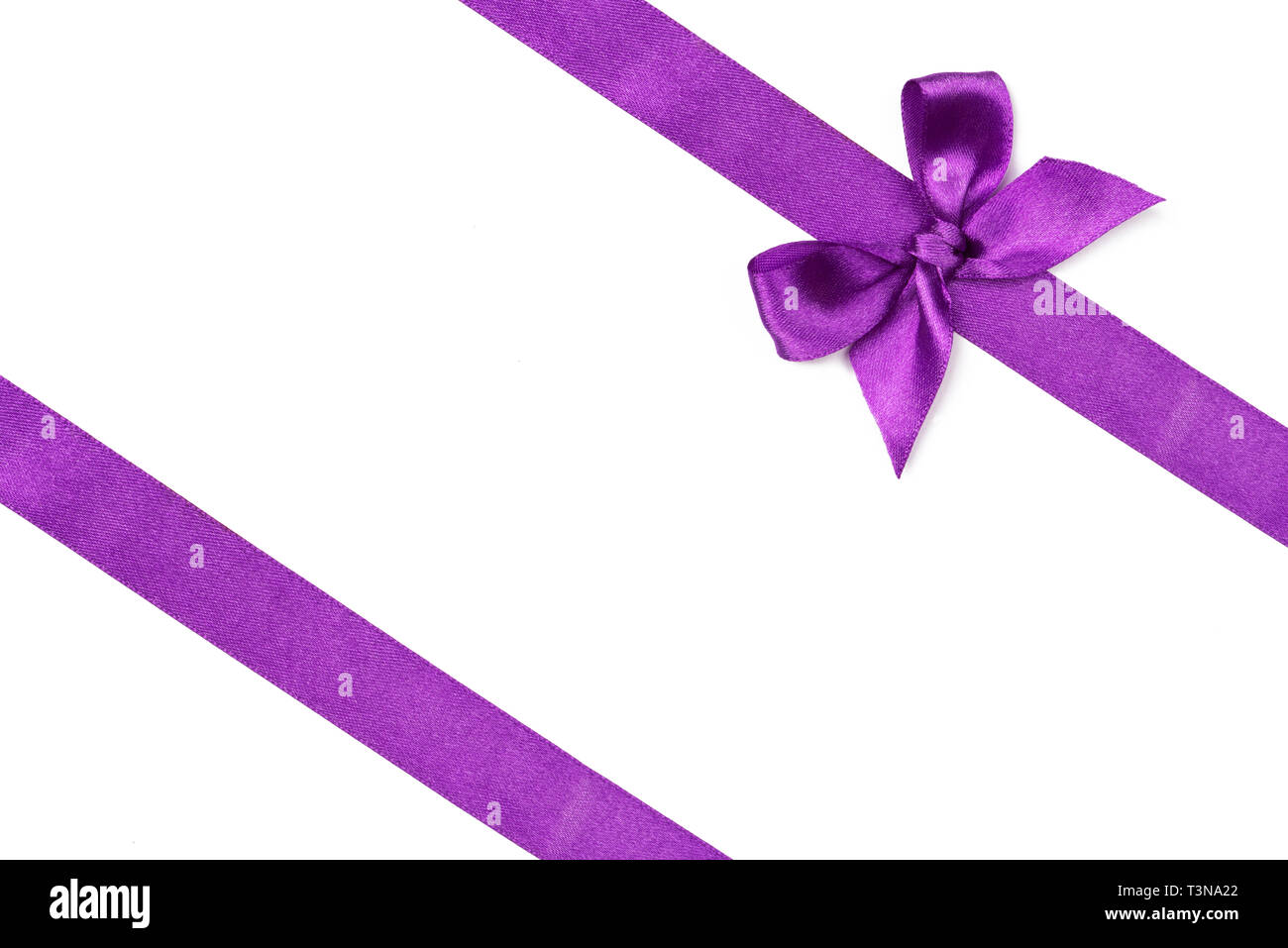 Purple ribbon with bow isolated on white Stock Photo
