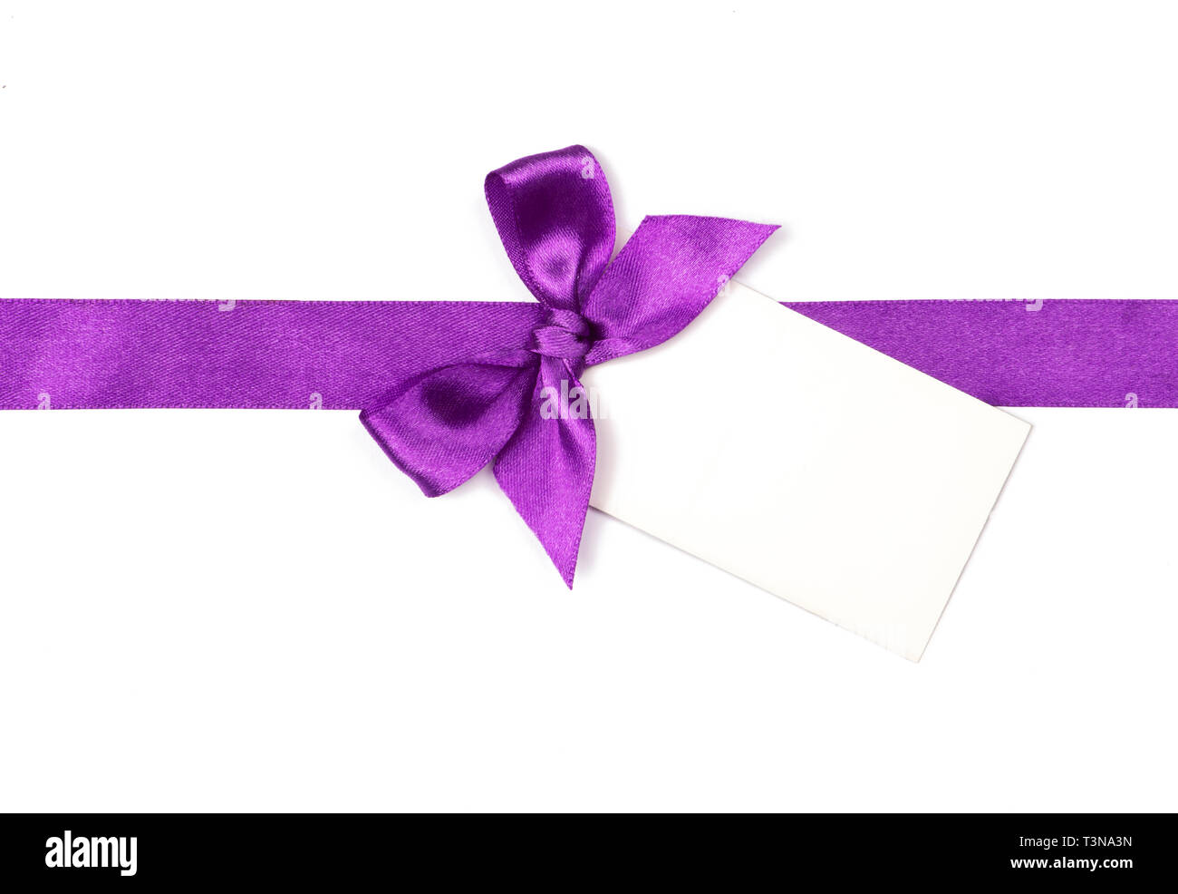 Purple ribbon with bow and card isolated on white Stock Photo