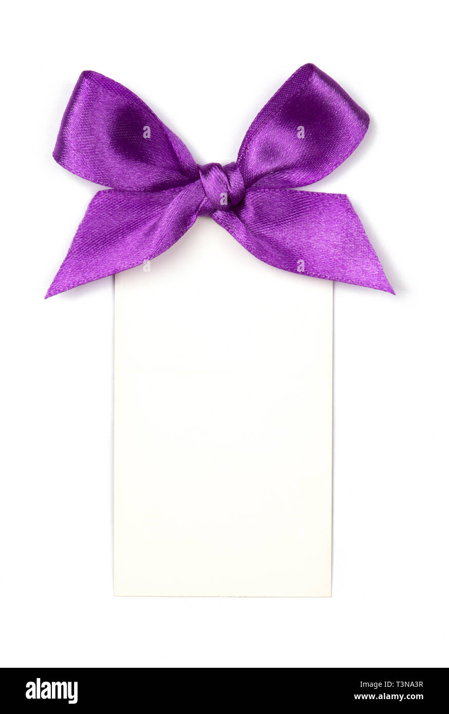 Purple ribbon with bow and card isolated on white Stock Photo