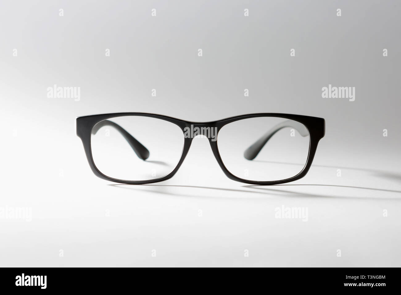 black rimmed glasses. the shadow of one's glasses. Stock Photo