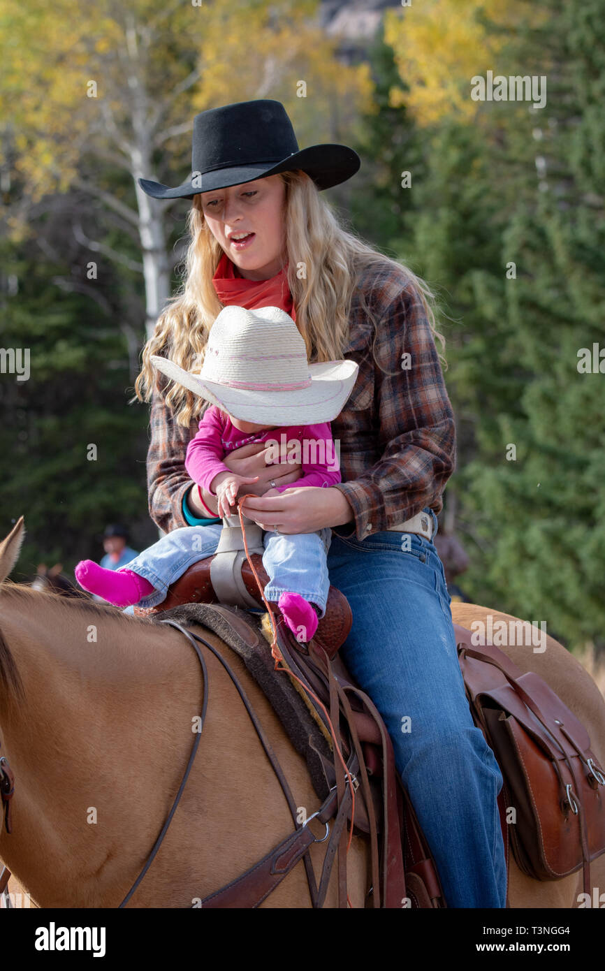 Cowgirl mother and baby Stock Photo