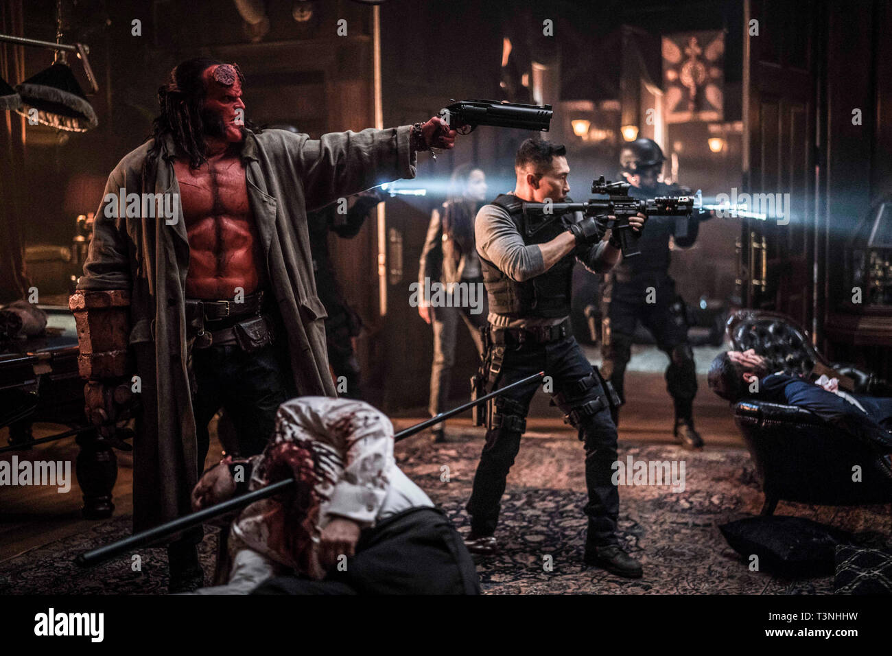 RELEASE DATE: April 12, 2019 TITLE: Hellboy STUDIO: Lionsgate DIRECTOR: Neil Marshall PLOT: Based on the graphic novels by Mike Mignola, Hellboy, caught between the worlds of the supernatural and human, battles an ancient sorceress bent on revenge. STARRING: DANIEL DAY KIM as Ben Daimio, SASHA LANE as Alice Monoghan, DAVID HARBOUR as Hellboy. (Credit Image: © Lionsgate/Entertainment Pictures) Stock Photo