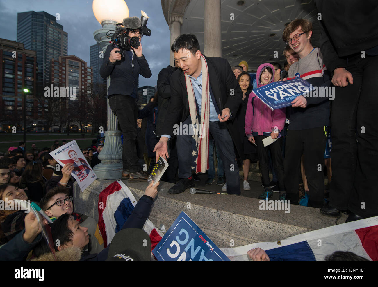 Boston, USA. 10th Apr, 2019. Boston, MA, USA. YANG 2020 American presidential campaign rally at the Parkman Bandstand on the Boston Common. More than 1,000 supporters of Andrew Yang gathered to meet and hear Democratic candidate Yang speak at the Boston Common. Photo shows Yang, who has authored several books signing books and posters after the event. Credit: Chuck Nacke/Alamy Live News Stock Photo