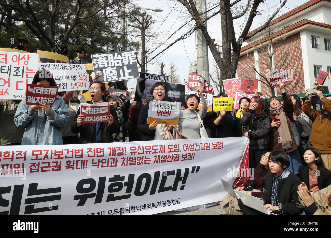 11th Apr, 2019. Ruling on anti-abortion law A group of civic activists calling for the repeal of the current anti-abortion law reacts in front of the Constitutional Court in Seoul as the court ruled the law unconstitutional on April 11, 2019. Aborting a fetus is punishable by a prison term of up to one year or a 2 million-won (US$1,750) fine under the Mother and Child Health Law enacted in 1953. Credit: Yonhap/Newcom/Alamy Live News Stock Photo