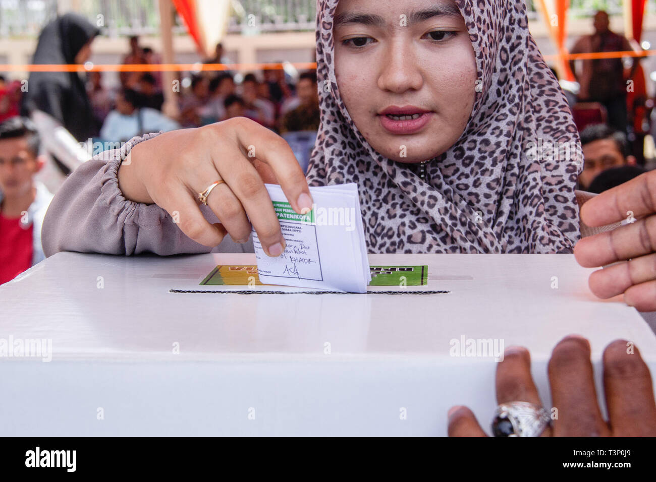 Lhokseumawe, Indonesia. 11th Apr, 2019. A woman seen casting her ballot during pre-election drill for president, vice-presidential candidates and legislative candidates in Lhokseumawe, Aceh province, Indonesia. Elections in Indonesia will take place next week on Wednesday April 17, 2019. Credit: SOPA Images Limited/Alamy Live News Stock Photo
