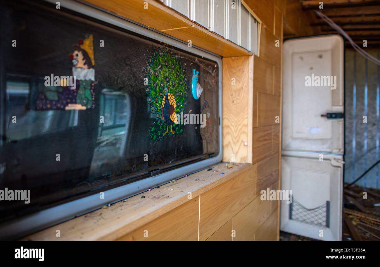 11 April 2019, North Rhine-Westphalia, Lügde: Painted children's window pictures hang on a pane of a caravan on the plot of land of the alleged perpetrator on the camping site Eichwald in the district of Elbrinxen, some of which has already been torn down. The campsite operator has the crime scene demolished, where several children were abused and filmed. The demolition work will continue until the weekend due to the large quantity. Photo: Guido Kirchner/dpa Stock Photo