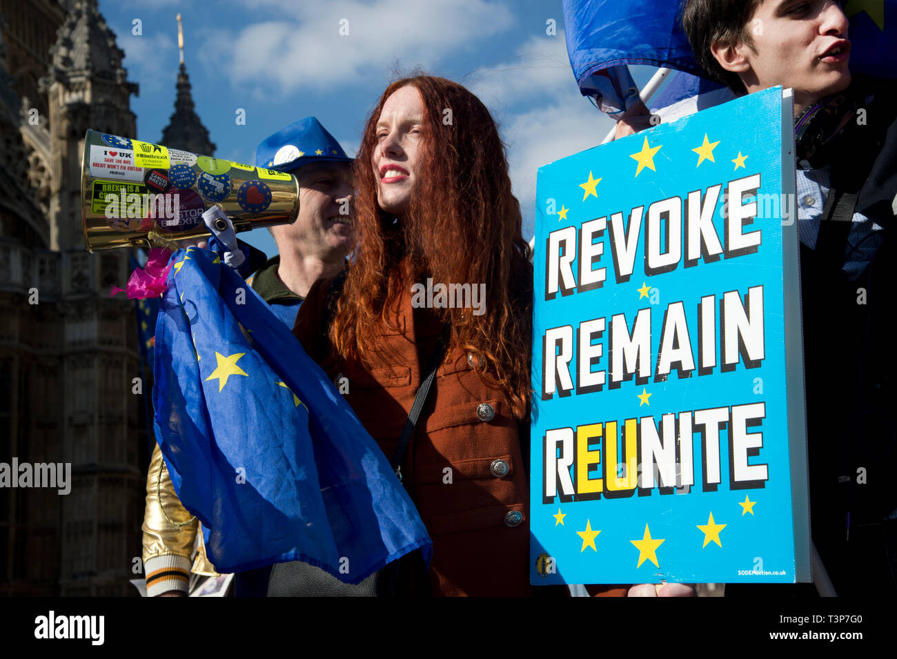 Westminster April 10th 2019. Remain protesters in front of the Houses of Parliament with a placard saying Revoke, Remain, Reunite. Stock Photo