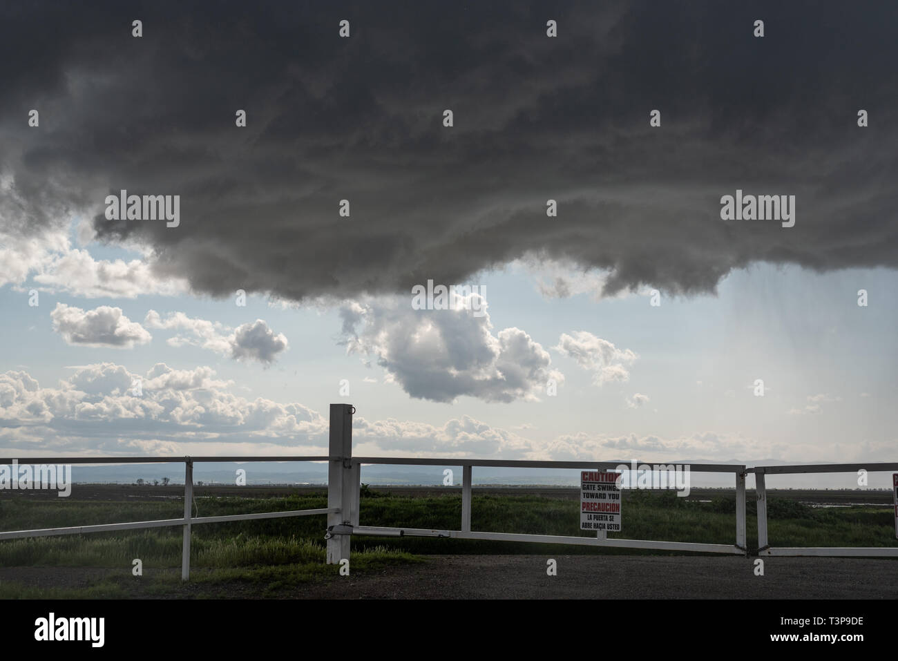 A lowering of a rotating mini-supercell in Colusa county, northern California, in late March 2019. Stock Photo