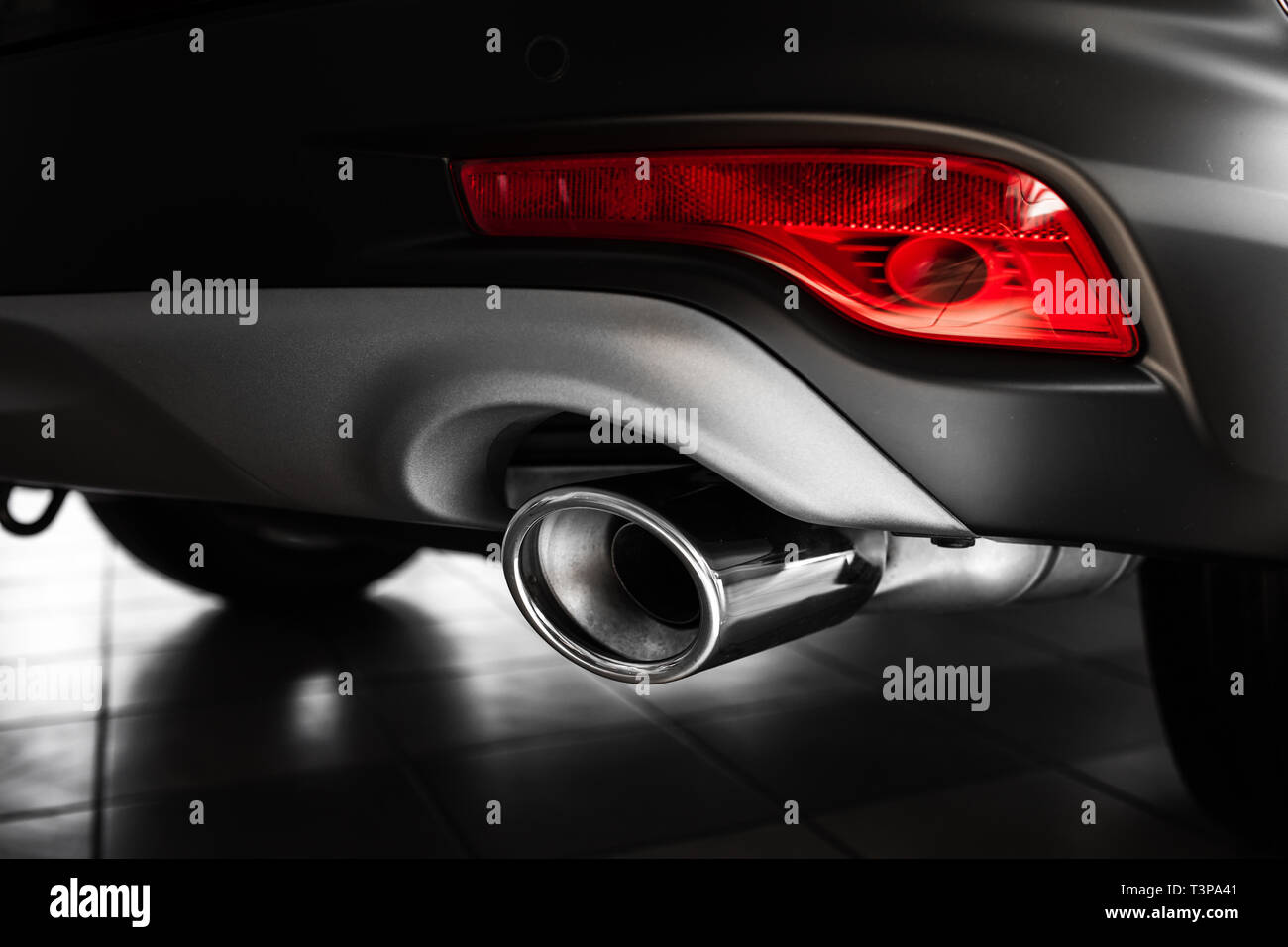 car exhaust pipe. Exhaust pipe of a luxury car. details of stylish car interior, leather