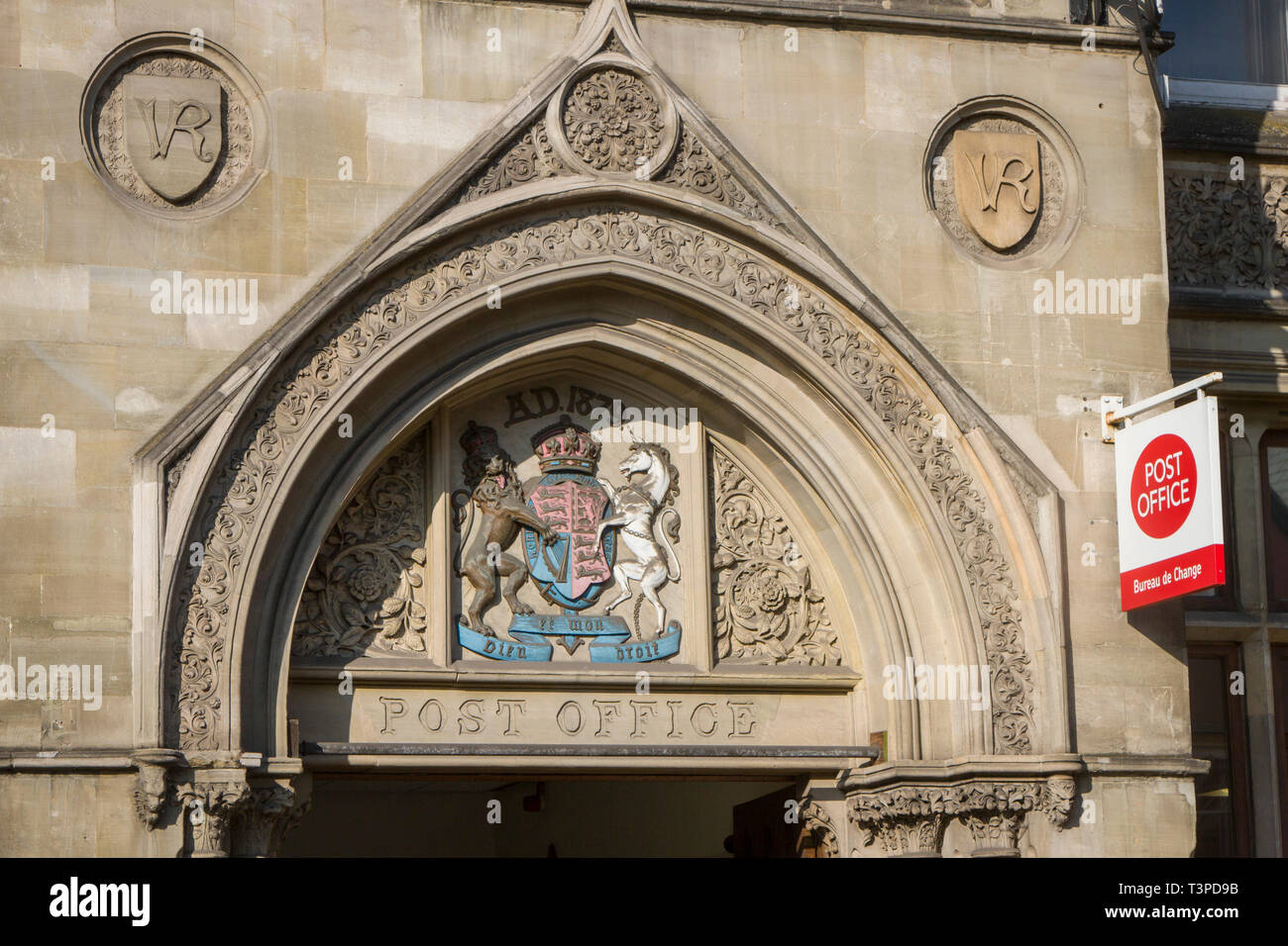 The ancient carved stone ddecoration above the entrance to Oxford main