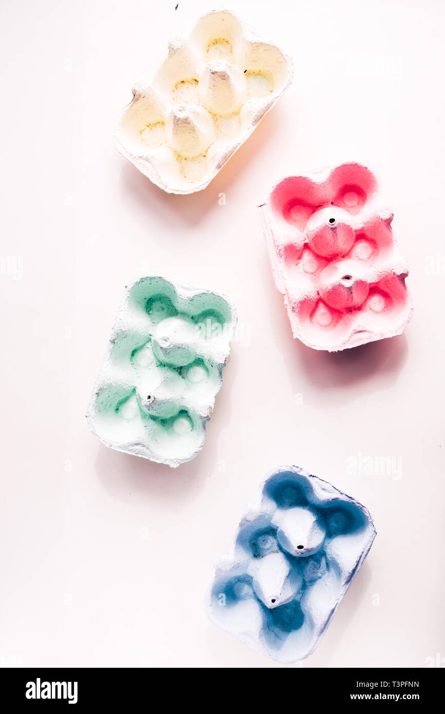 Colored eggs container, easter concept, hard natural direct light Stock Photo