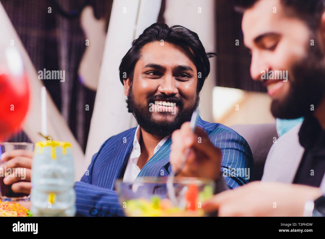 Two Man In Bar Hold Glasses Sit At Counter Drinking Cocktail Cheerful Friends Meeting Bar