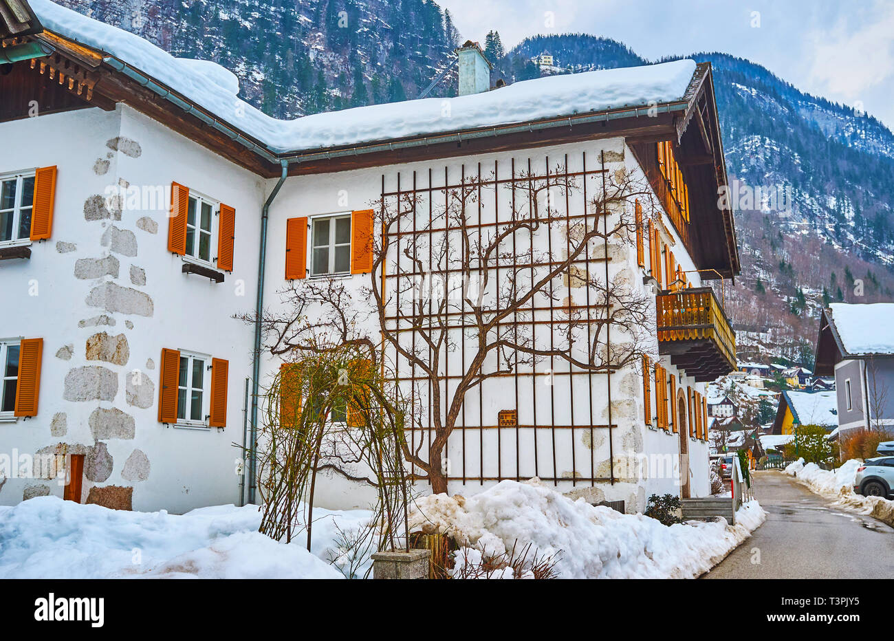 Traditional edifice with colorful wooden shutters, carved balcony and ... - Hallstatt Balcony Ideas Inspiration