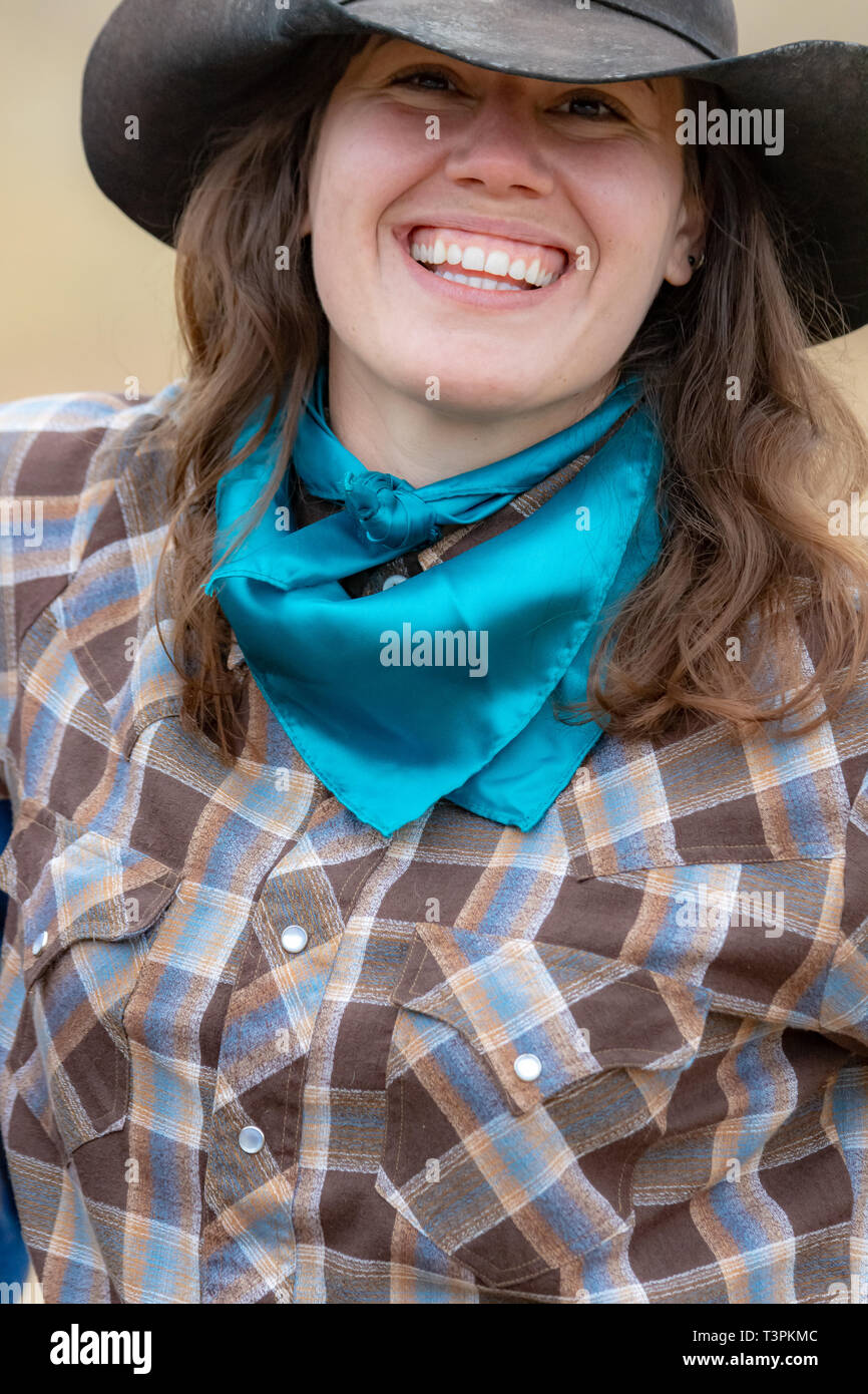 Smiling American cowgirl Stock Photo
