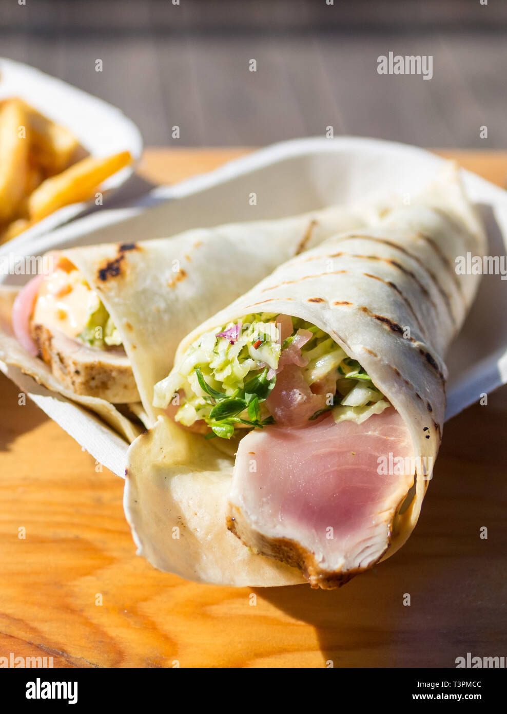 Hand-roll style albacore tuna tacos and chips from Red Fish Blue Fish Restaurant in Victoria, British Columbia, Canada. Stock Photo