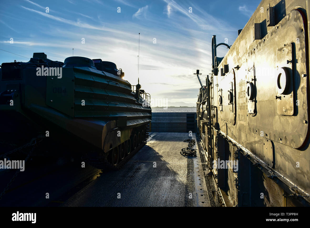 190409-N-OX029-1183SOUTH CHINA SEA (April 9, 2019) – A Landing Craft, Air Cushion assigned to Naval Beach Unit 7 transports an assault amphibious vehicle from the well deck of the amphibious assault ship USS Wasp (LHD 1) during Exercise Balikatan 2019. In its 35th iteration, Exercise Balikatan is an annual U.S.-Philippine military training exercise focused on a variety of missions, including humanitarian assistance and disaster relief, counter-terrorism, and other combined military operations. (U.S. Navy photo by Mass Communication Specialist 3rd Class Benjamin F. Davella III) Stock Photo