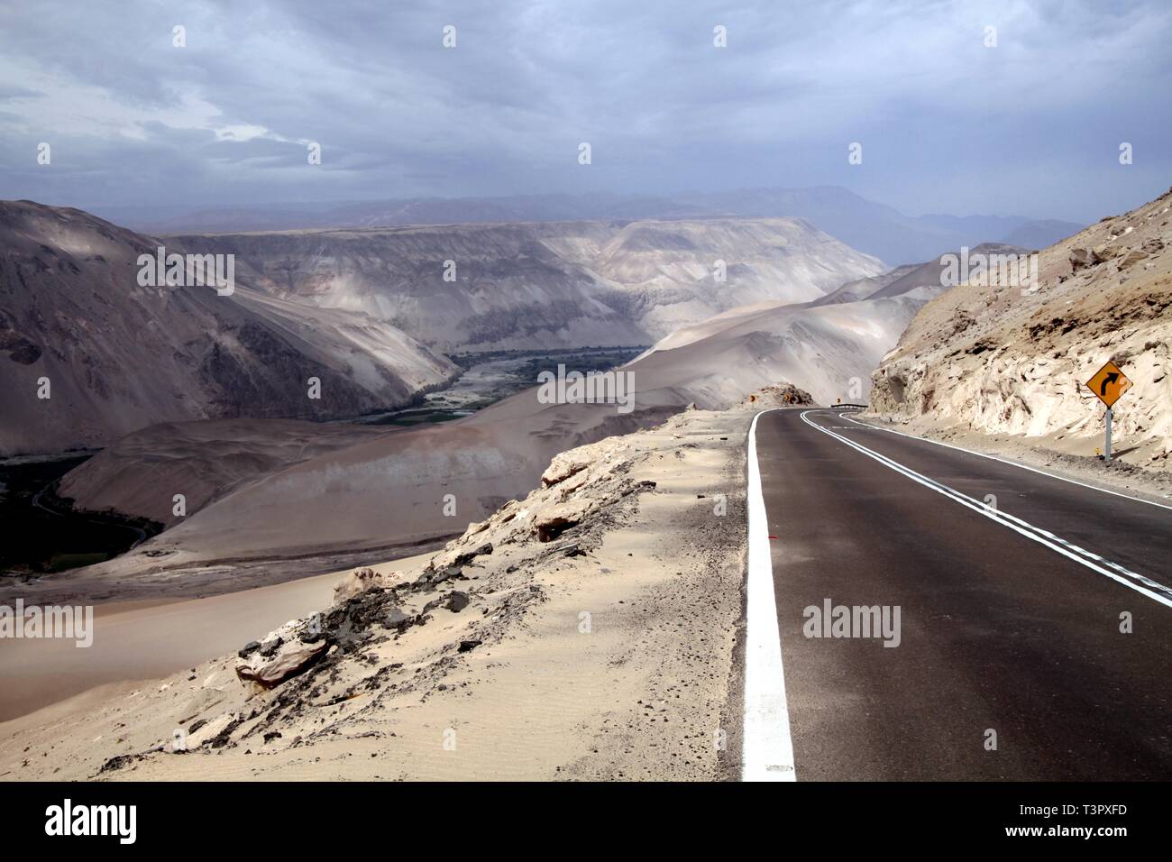 Highway through Cordillera de la Sal (Salt mountains) with blurred horizon, Atacama desert Stock Photo
