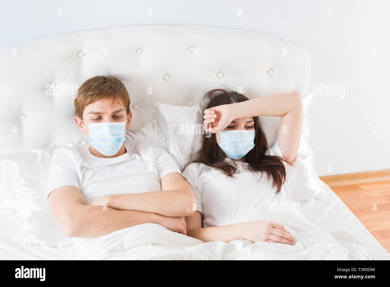 couple in bed suffering common cold Stock Photo Alamy