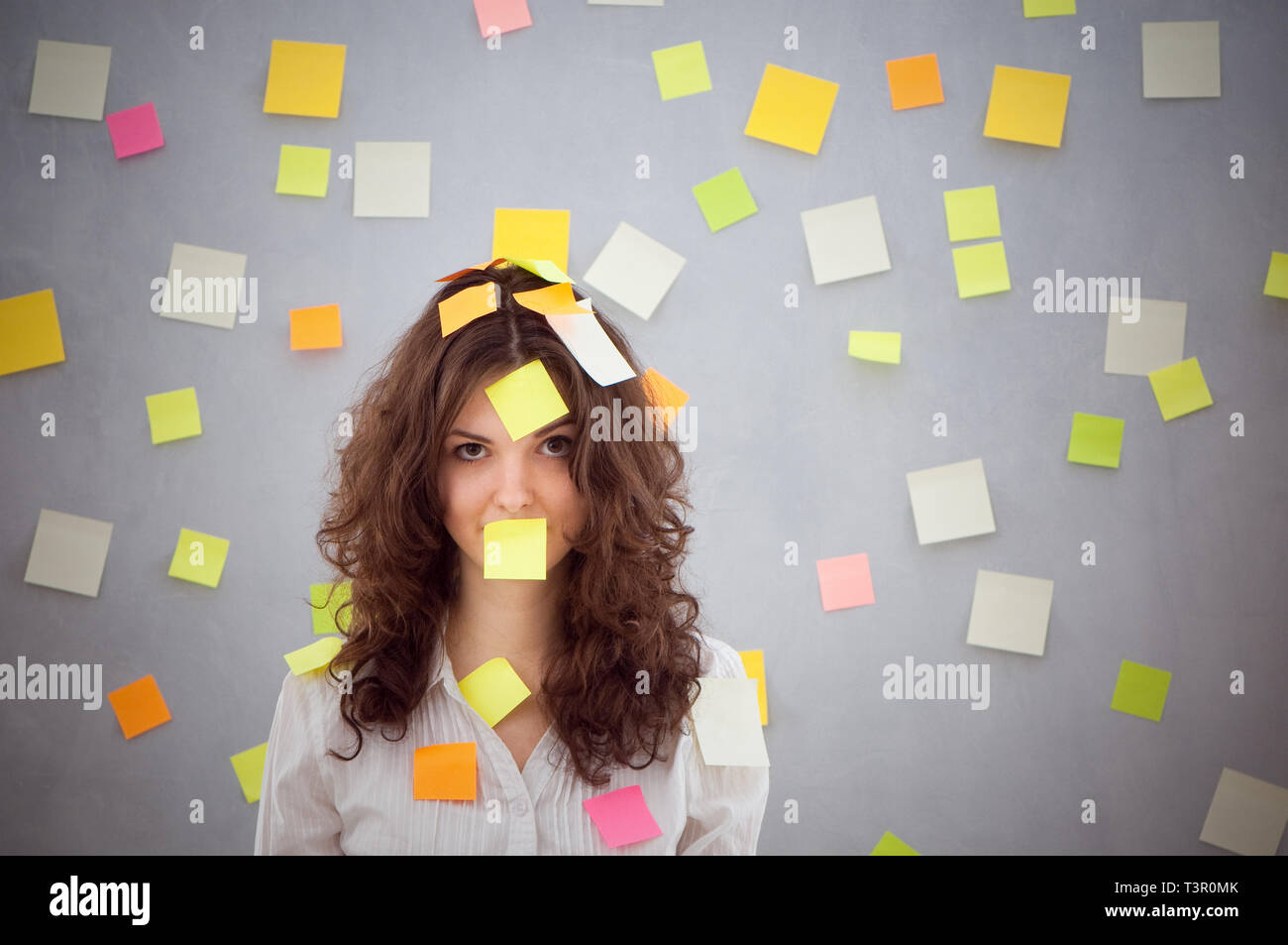 secretary overwhelmed with sticky reminder notes Stock Photo - Alamy
