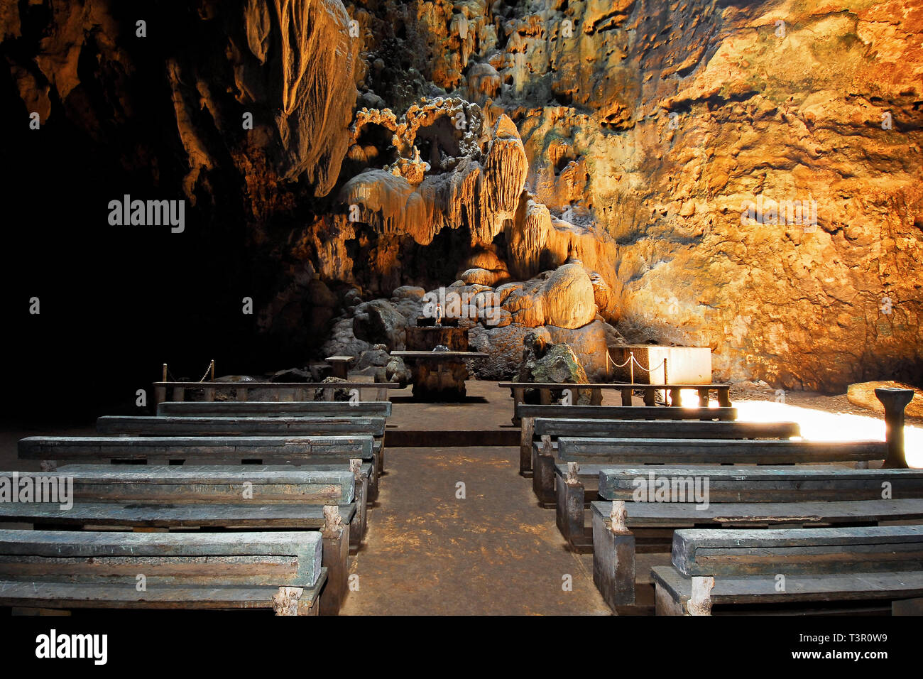 Penablanca, Cagayan Province, Philippines - May 19, 2008: Church built by local people inside the first chamber of the illuminated Callao Cave Stock Photo