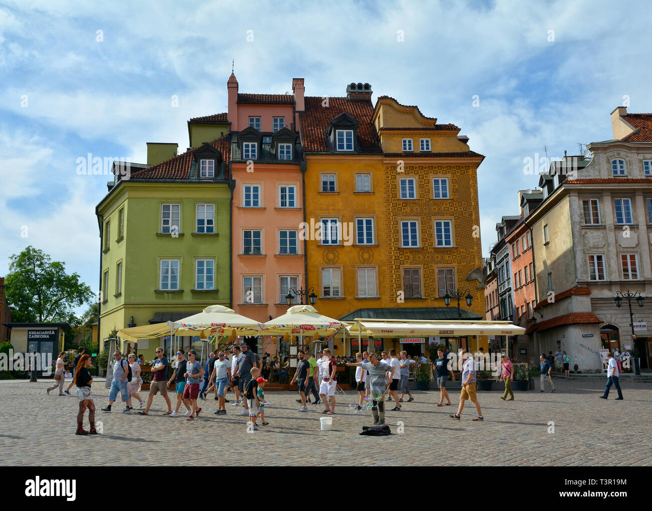 Playing with the soap bubbles in the Old Town Stare Miasto Warsaw, Castle Square, Poland's capital. Stock Photo