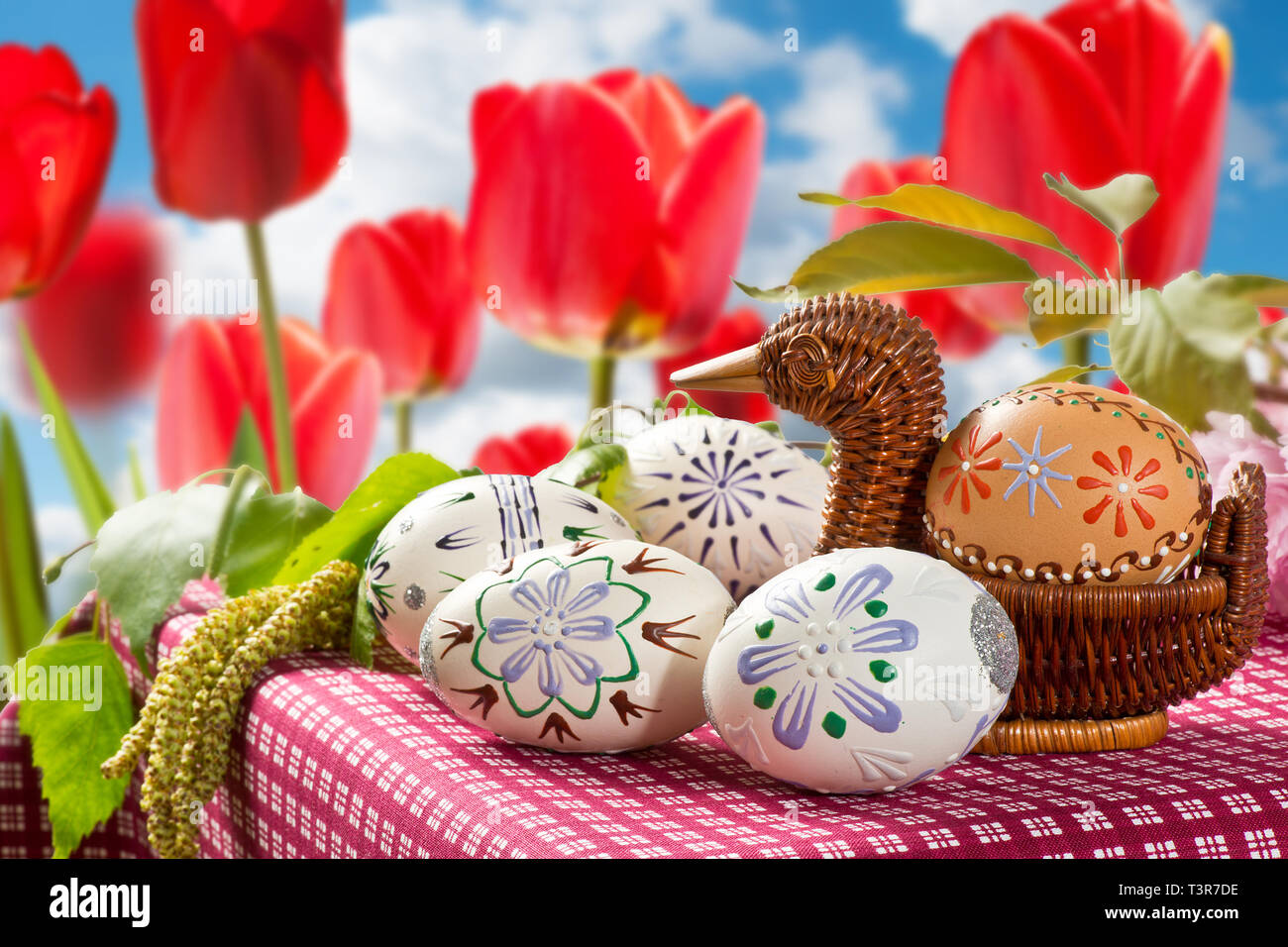 Painted Easter eggs with tulips in the garden Stock Photo