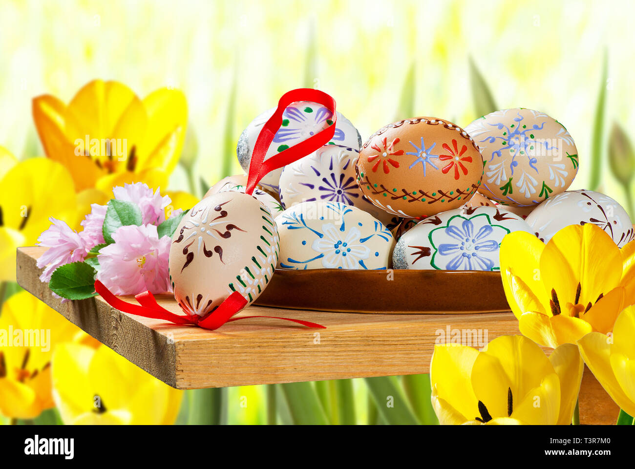 Painted Easter eggs with tulips in the garden Stock Photo - Alamy