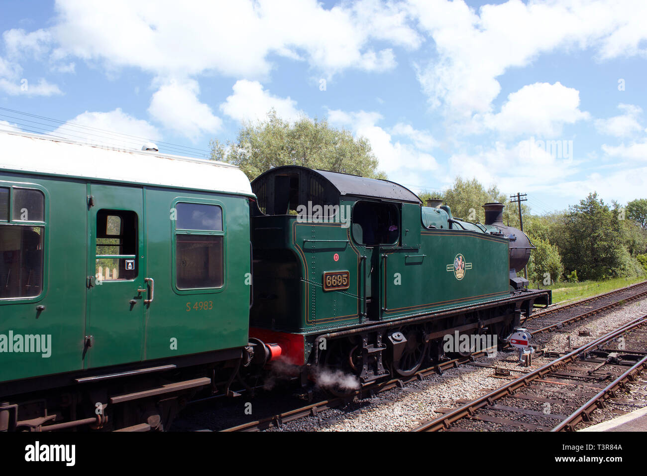Swanage Steam Train departing Corfe Castle Station in Dorset, UK. Stock Photo