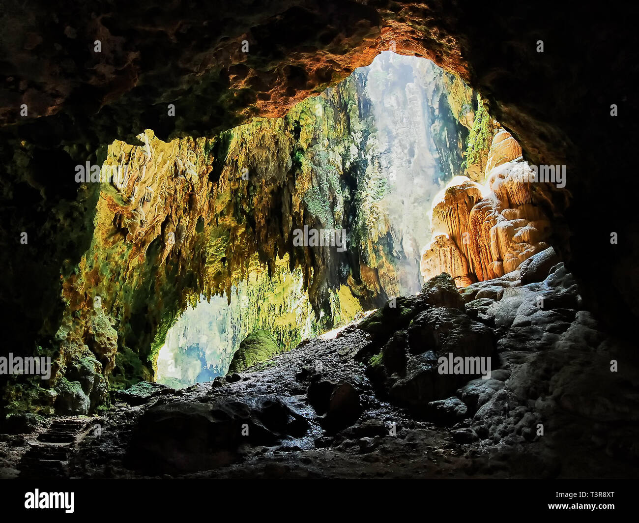 Penablanca, Cagayan Province, Philippines - May 19, 2008: View into one chamber of the limestone Callao Cave with sunlight entering from the rooftop Stock Photo