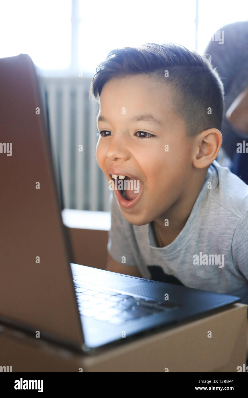 Family. Opening of cardboard boxes at home Stock Photo Alamy
