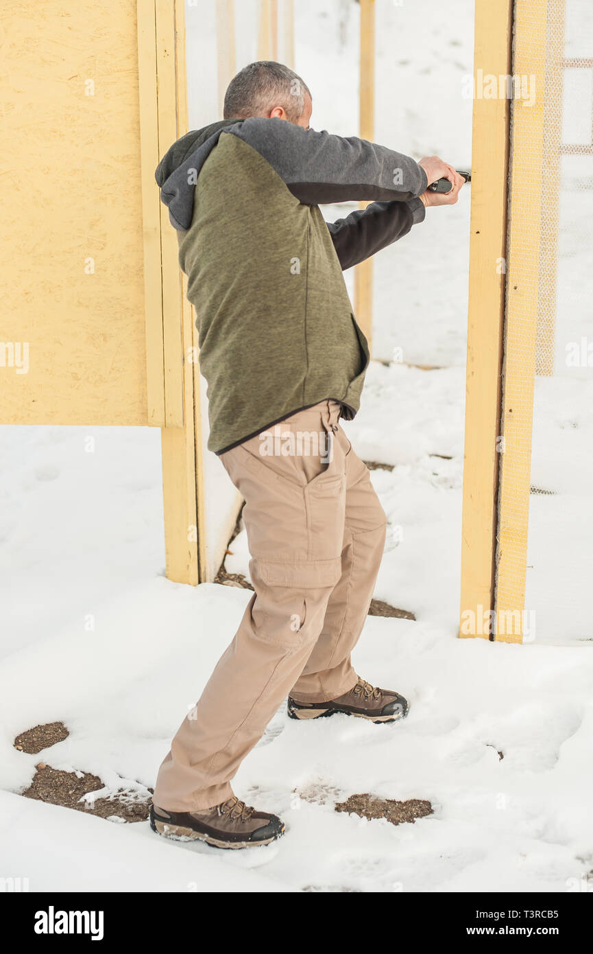 Indoor combat gun shooting training inside house. Advanced fighting