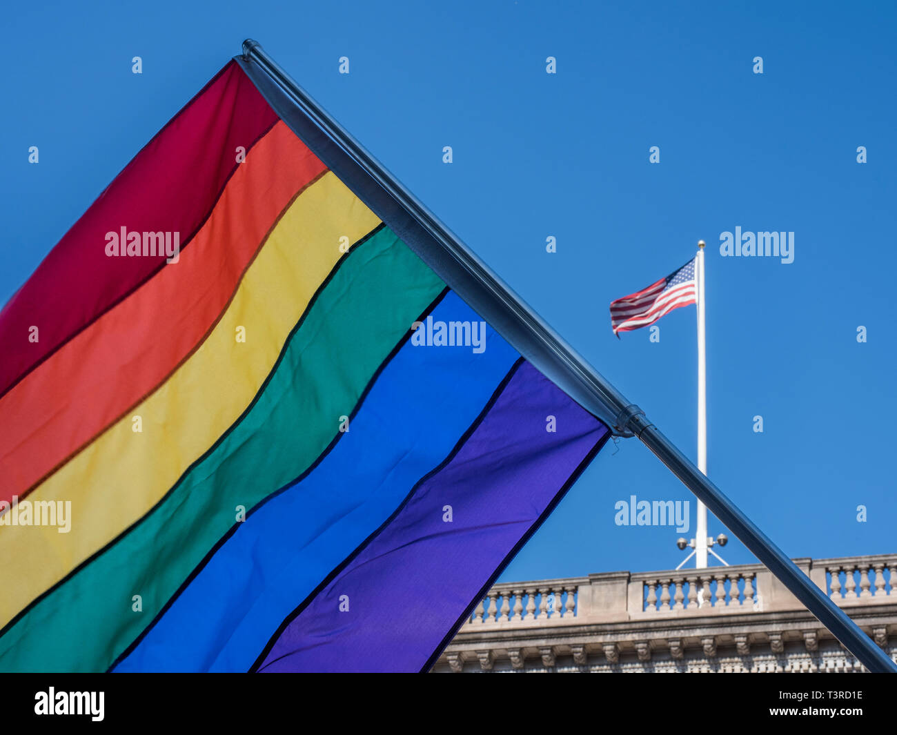 Pride flag in front of American flag Stock Photo