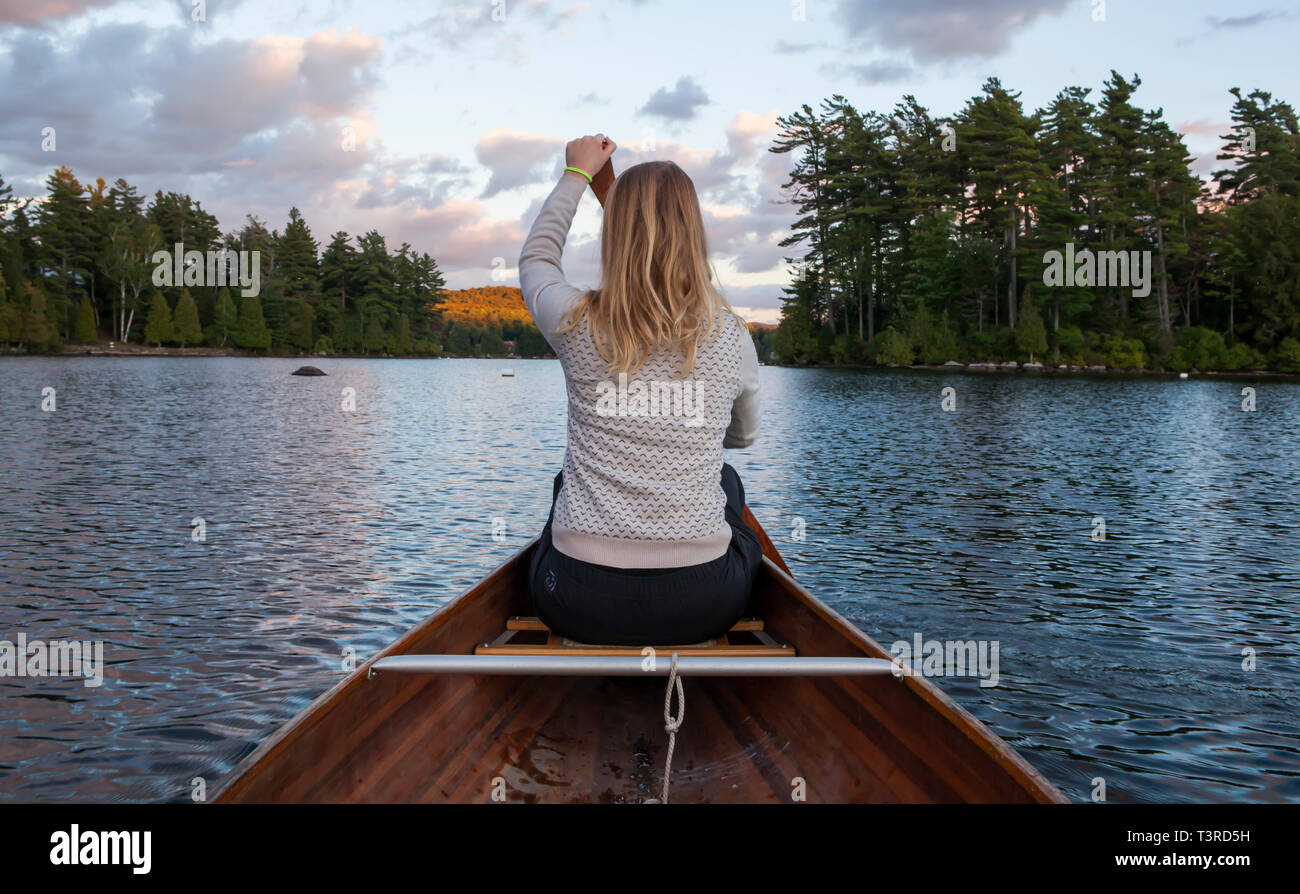 Canoeing on a lake upstate New York Stock Photo