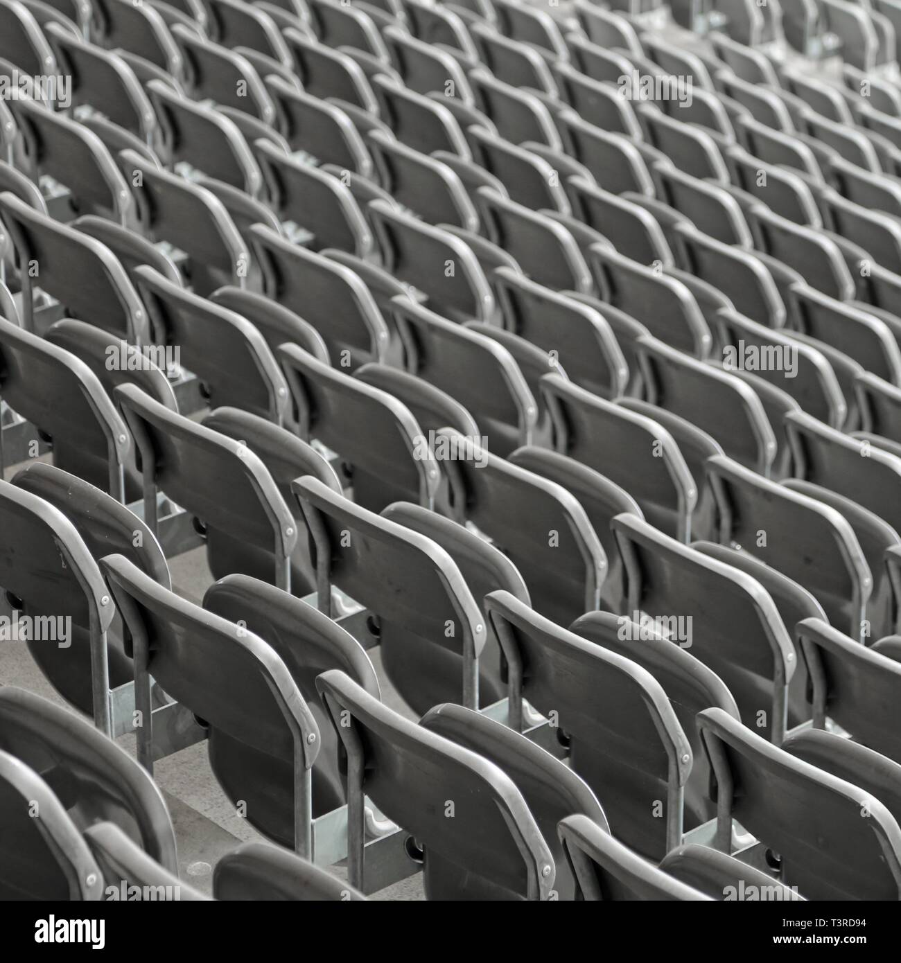 Grey Chairs On The Stadium Bleachers With No People Before The