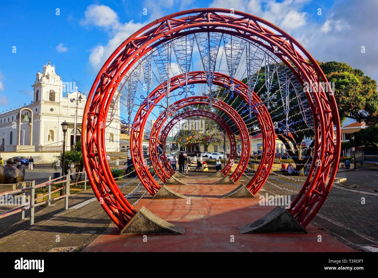 Concentric Red Circles Abstract Art Detail and Spanish Colonial Architecture on Plaza De Las Artes (Arts Town Square) San Jose Costa Rica City Center Stock Photo