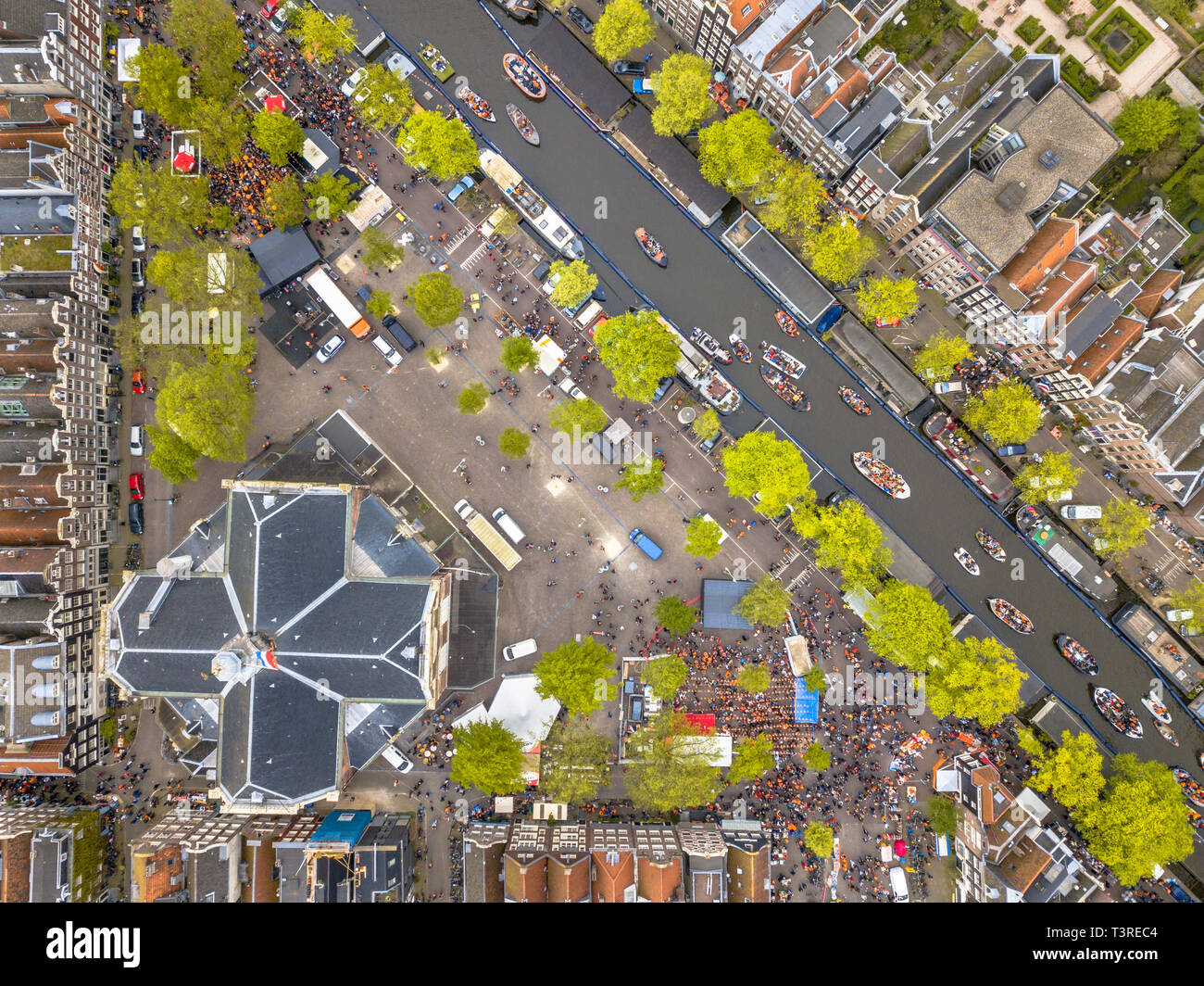 Market square Noordermarkt on Koningsdag Kings day festivities in Amsterdam. Birthday of the king. Seen from helicopter. Stock Photo