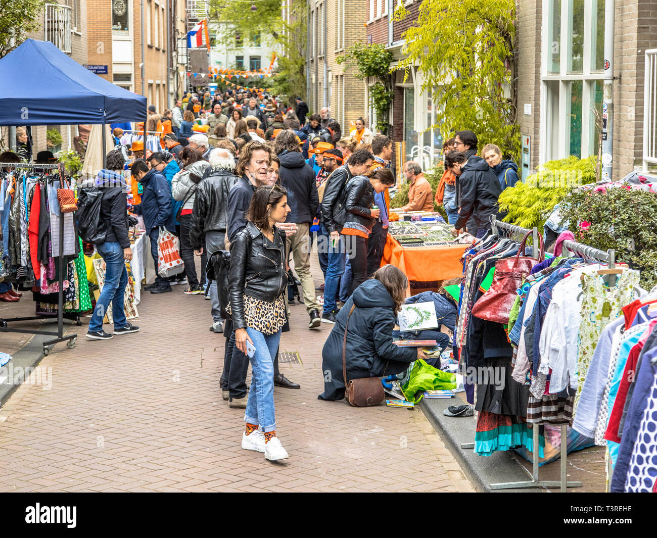 AMSTERDAM, THE NETHERLANDS - APRIL 27 2018: Crowd of people browsing on vrijmarkt flea market on annual Koningsdag. Birthday of the king. Stock Photo