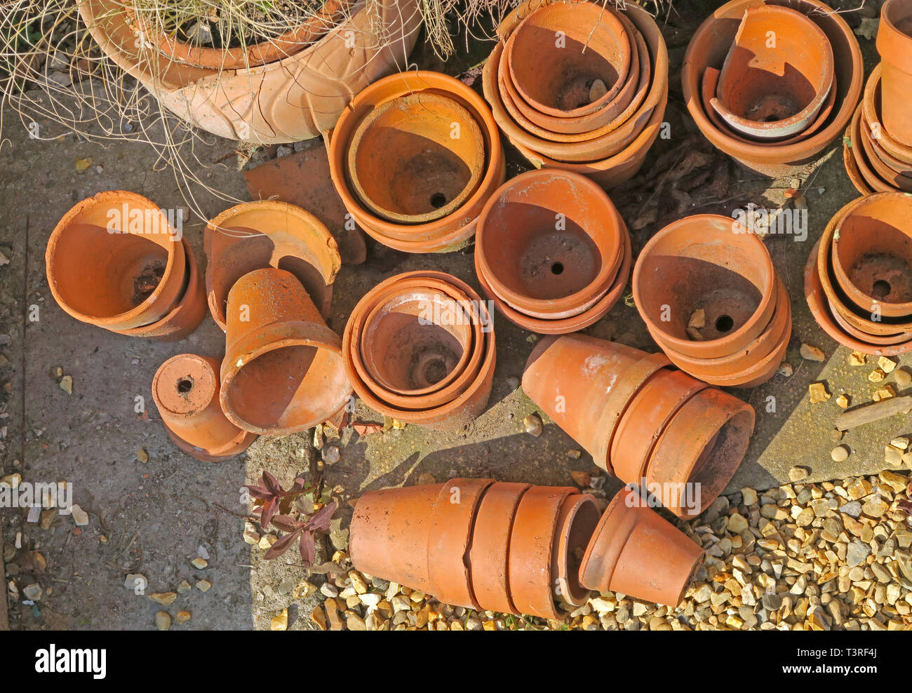 Old Terracotta plant pots, in a garden corner Stock Photo