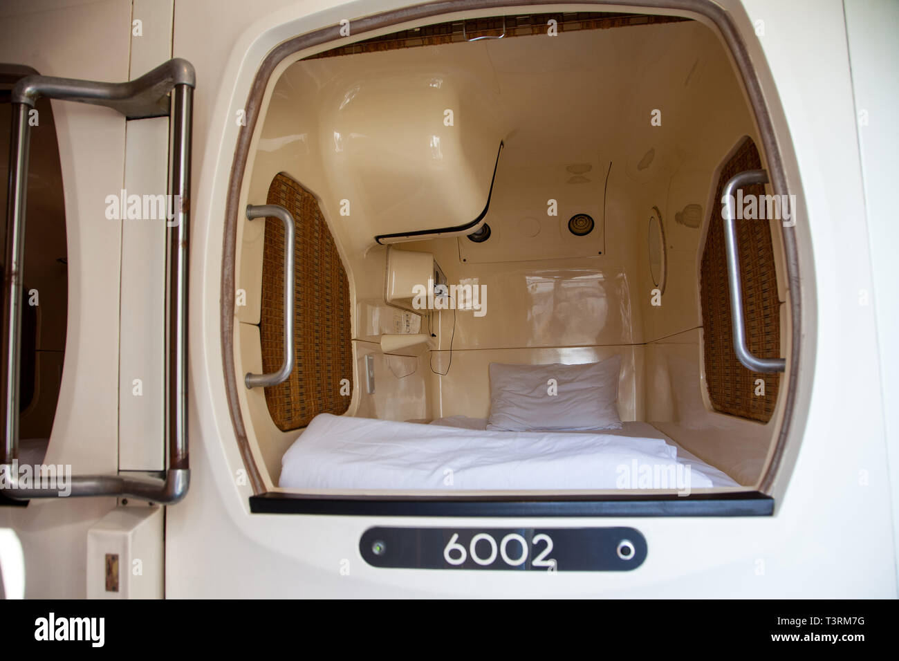 Japan: Tokyo. Interior of a capsule hotel's cabin, typical from Japan, a type of hotel that features a large number of extremely small rooms intended  Stock Photo