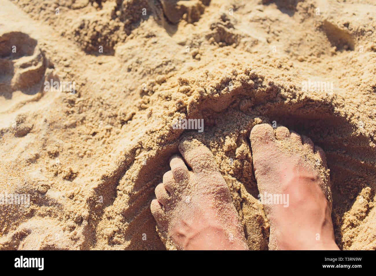 Woman tanned legs on sand beach. Travel concept. Happy feet in tropical ...