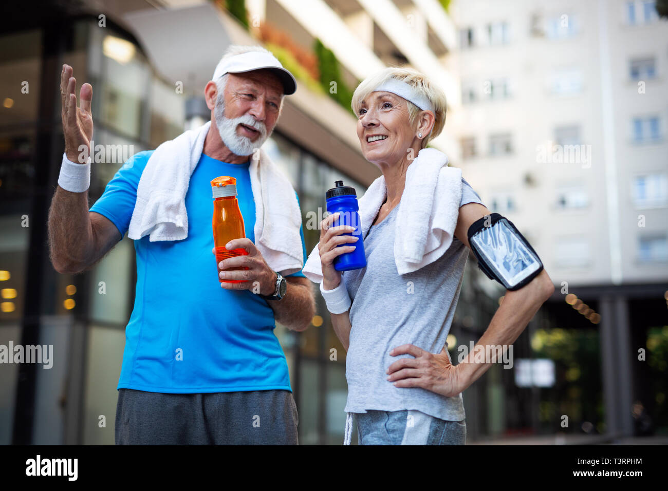Happy senior couple staying fit by sport running Stock Photo
