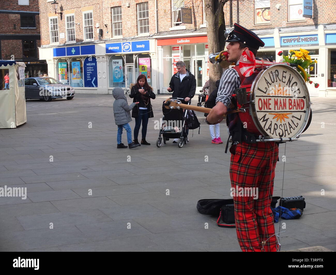 One man band performer Laurence Marshall performing in Kings Square, York, UK Stock Photo