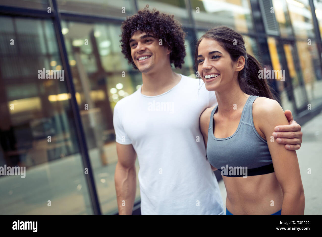 Couple jogging and running outdoors in city Stock Photo - Alamy