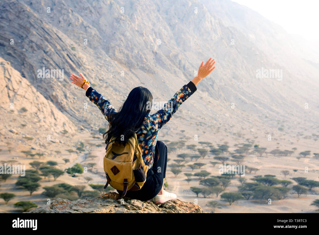 Woman enjoying desert scenery on a hiking trip Stock Photo