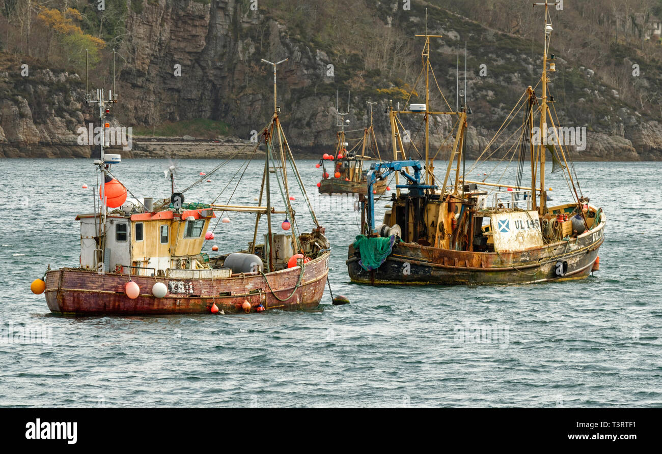 ULLAPOOL ROSS AND CROMARTY SCOTLAND THREE OLD FISHING BOATS MOORED IN LOCH BROOM Stock Photo