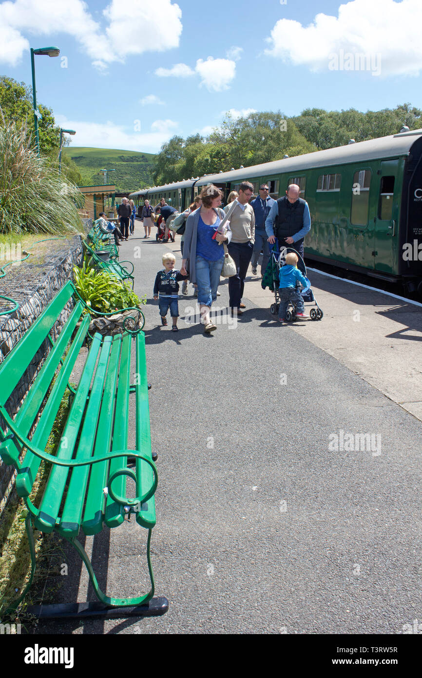 Families disembarking a heritage train in Corfe Castle Station in Dorset, UK. Stock Photo